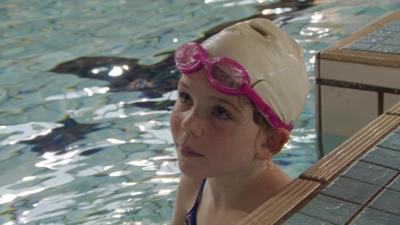 A child in a swimming pool