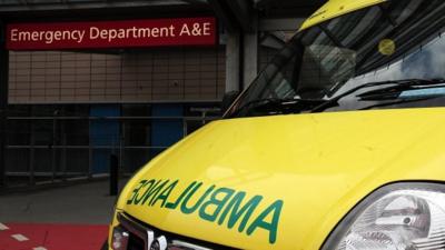 An ambulance outside the entrance to a hospital Accident and Emergency