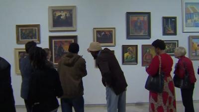 People looking at the Song for Sekoto exhibition in Johannesburg