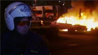 An emergency worker close to a fire