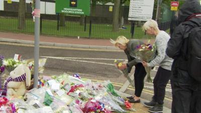 Locals lay flowers at the scene of the attack