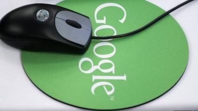 A mouse and Google mousepad