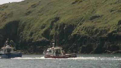 The Lady Helen being helped by her sister boat