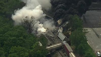 Derailed train carriages and smoke