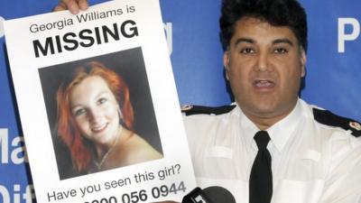 Superintendent Nav Malik of West Mercia Police holding a picture of Georgia Williams