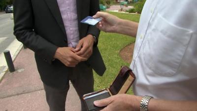 Man holds European Health Insurance Card