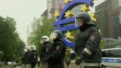 Police in front of euro sign