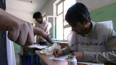 An Afghan registers for a voting card