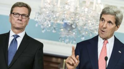 German Minister of Foreign Affairs Guido Westerwelle(L) listens while US Secretary of State John Kerry speaks during a press conference at the US State Department May 31, 2013 in Washington