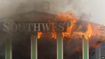 Southwest Inn sign engulfed in flames