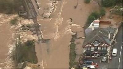 Cowley Bridge and Inn next to the flooded railway