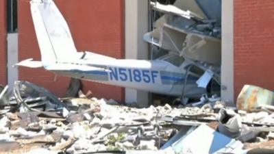 Plane wreckage in side of building