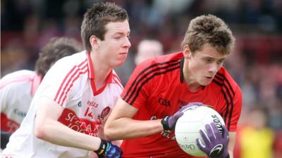 Niall Loughlin of Derry competes for the ball with Down's Pat Havern in the Ulster Minor Football Championship match