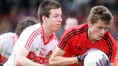 Derry's Niall Loughlin competes for the ball with Down's Pat Havern in the Ulster Minor Football Championship at Celtic Park