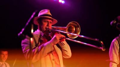 A musician plays at a speakeasy in NYC