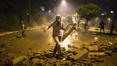 A protester wearing a gas mask