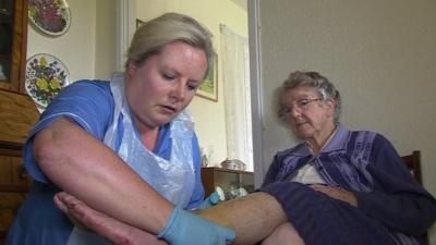 A district nurse with a patient