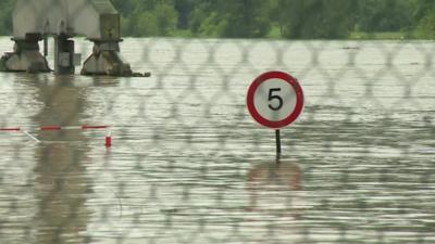 Road sign submerged