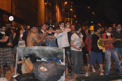 Protesters making barricades from cobblestones