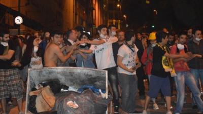 Protesters making barricades from cobblestones