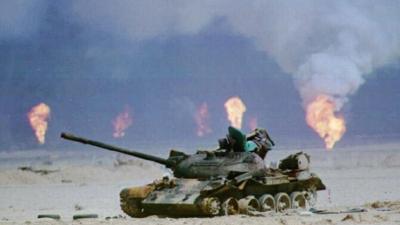 Kuwaiti oil wells on fire behind an Iraqi tank, 1991