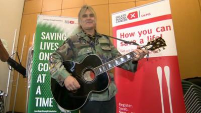 Mike Peters playing his guitar