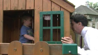 Ed Miliband and a children's playhouse