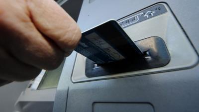 Card being put into a cash machine