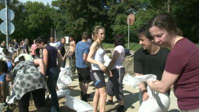 Volunteers with sandbags