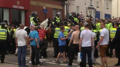 Protestors and mounted police