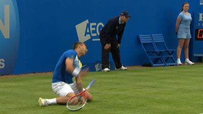 Dan Evans falls at Queen's