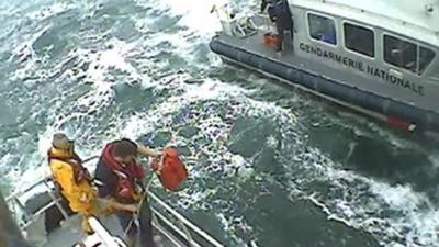 French authorities and British crewmen during their operation to rescue 10 people from the English Channel