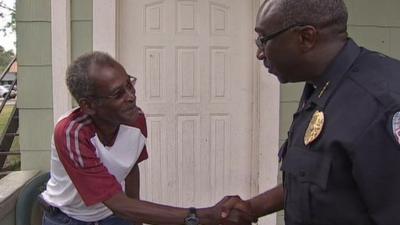 Sanford police chief shakes hand with resident