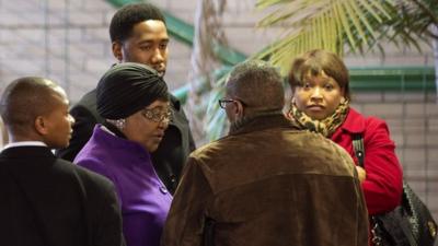 Winnie Madikizela-Mandela leaves the Mediclinic Heart Hospital in Pretoria, accompanied by her daughter and grandson