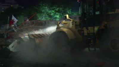 Bulldozer clears barricades in Taksim Square, Turkey