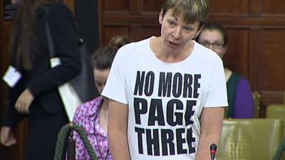 Caroline Lucas wearing T-shift saying 'No More Page Three'