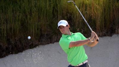 Rory McIlroy plays a bunker shot during practice at Merion on Wednesday