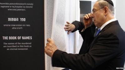 Israel"s Prime Minister Benjamin Netanyahu looks at "The Book of Names" at the Auschwitz-Birkenau State Museum in Oswiecim