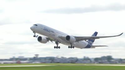 The Airbus A350 taking off