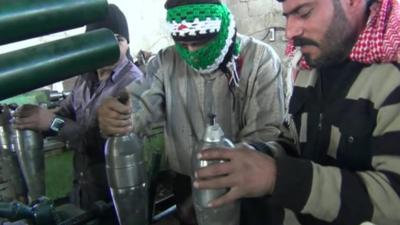 Syrian opposition fighters with homemade weapons