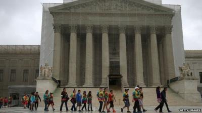 Children walking past Supreme Court