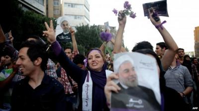 Supporters of Hassan Rouhani celebrate in the streets