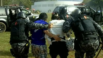 The family is moved to safety by police