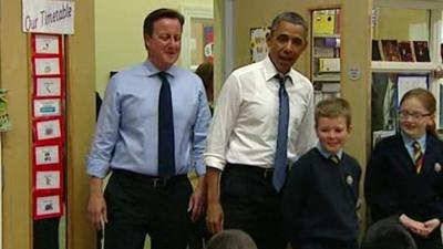 David Cameron and Barack Obama in classroom with children