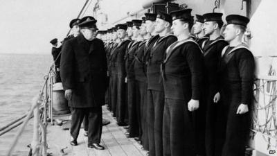 Prime Minister Winston Churchill inspects H.M.S. Scylla in 1942, during the Russian convoy operations