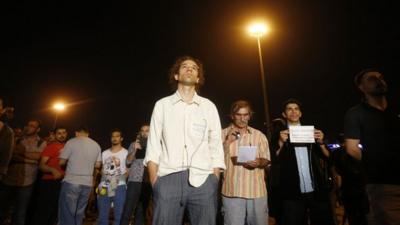 Erdem Gunduz (C) stands in a silent protest at Taksim Square in Istanbul early June 18, 2013