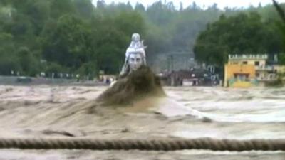 Statue of Hindu God submerged in flood waters