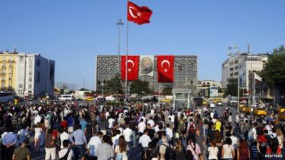 Protesters in Istanbul's Taksim Square, facing Ataturk Cultural Center