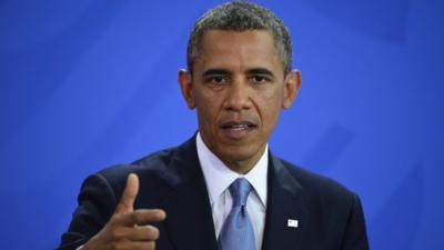 US President Barack Obama gestures during a joint press conference with German Chancellor on June 19, 201