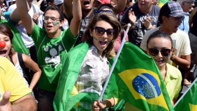 Protestors wave Brazilian flags